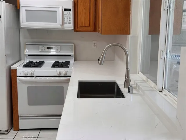 New quartz countertop with new sink,& facet.