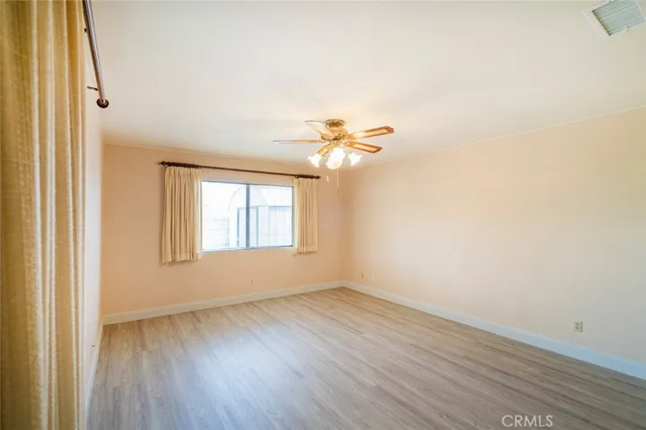 BEDROOM THREE HAS SLIDER TO PATIO-LARGE BEDROOMWITH CEILING FAN