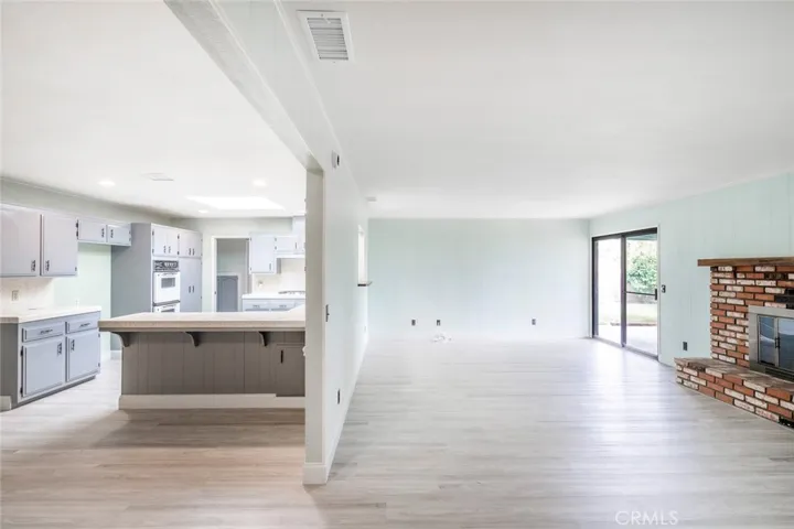 KITCHEN LOOKING INTO FAMILY ROOM