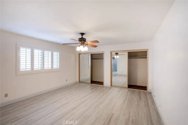 MASTER IS A LARGE ROOM WITH  MIRRORED SLIDING DOORS