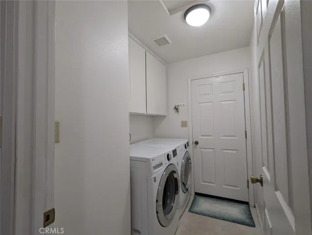 Hallway laundry with door to the garage