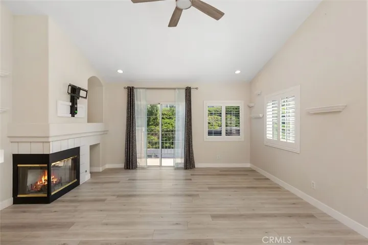 Family room offers fireplace and balcony
