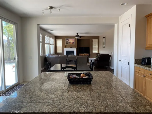 Kitchen Island and view of attached kitchen nook and big family room