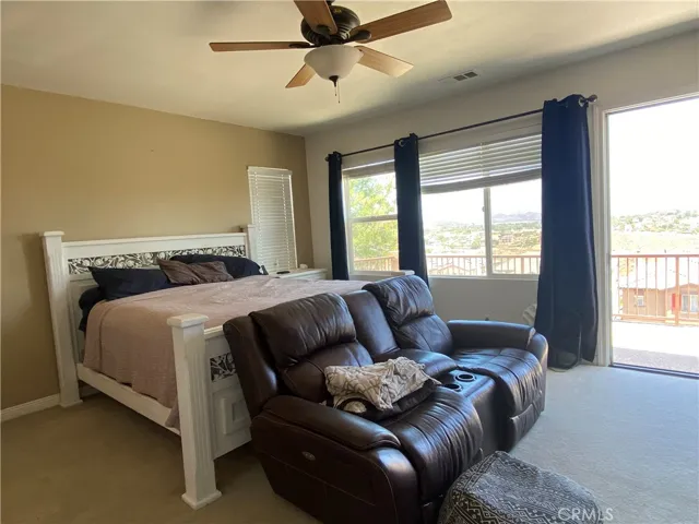 Master bedroom with huge balcony that overlooks Canyon lake and surrounding hills