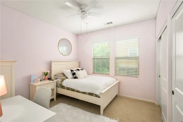 guest bedrooms each appointed with a ceiling fan and multiple dual-pane windows