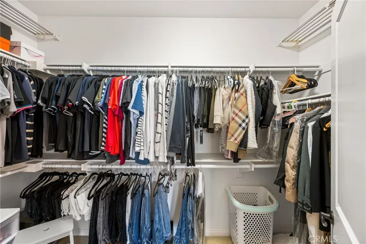 a sizeable primary walk-in closet