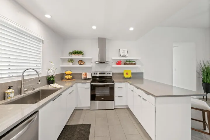 White Gloss Cabinetry & Floating Shelves