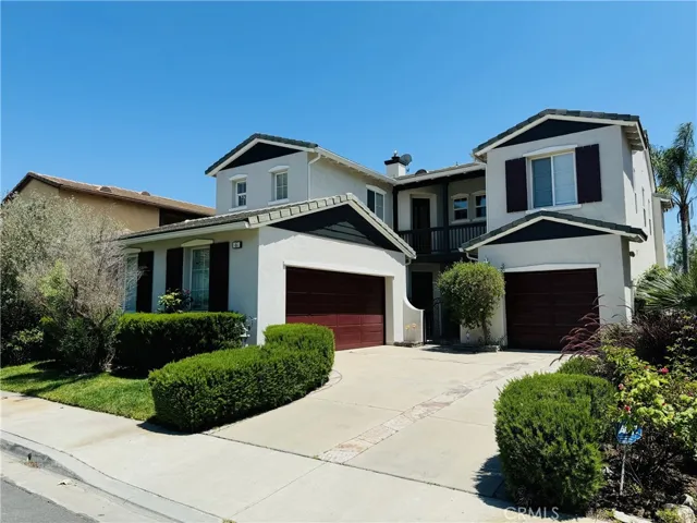 Front of house with fresh coat of paint and three car garage