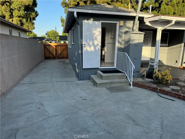 Backdoor and view of gated driveway