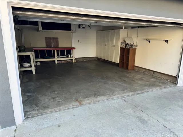 2 car garage with auto garage door opener and storage cabinets