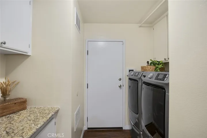 Storage & laundry off garage door entry