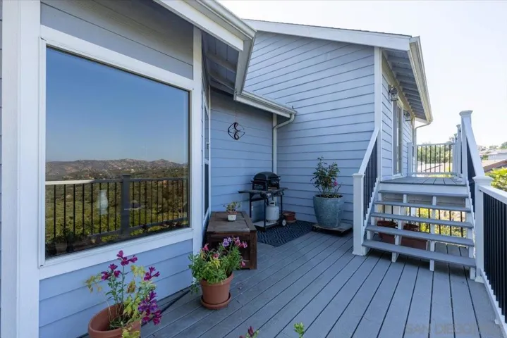 Stairs leading to the deck off the primary bedroom