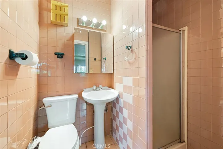 The well appointed 3/4 bathroom just off of the bedroom at 3723  East 5th Street