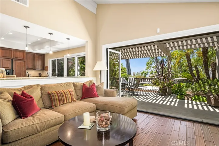 Living room accordion doors open to back patio