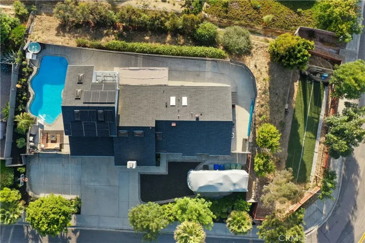 The property line is down to the chain link fence .. lots of space to add a deck. The green space to the right is perfect for a private ADU (or any other use you may need)