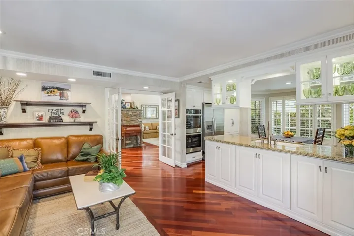 Looking from the family room towards the French doors to the living room