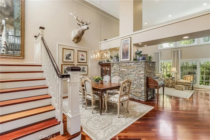 Enter into soring 17' ceilings and a custom stone fireplace