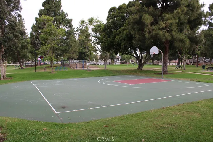 Half basketball court near the swings