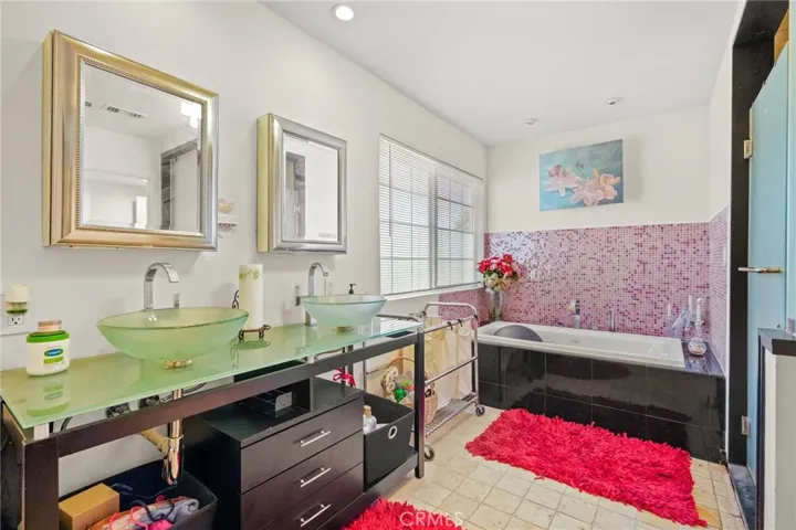 1st Master bathroom with stand in shower, jet tub & walk-in closet