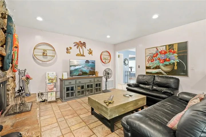Living room/Family room with fireplace.  This room is adjacent to the kitchen & breakfast nook