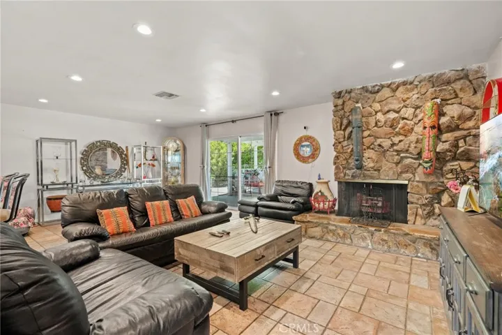 Living room/Family room with sliding door leading to the covered patio & back yard