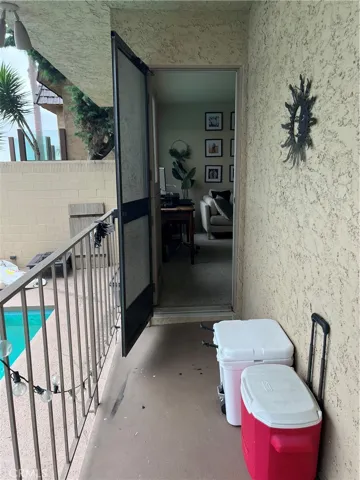 Outside patio walkway between rooms and kitchen