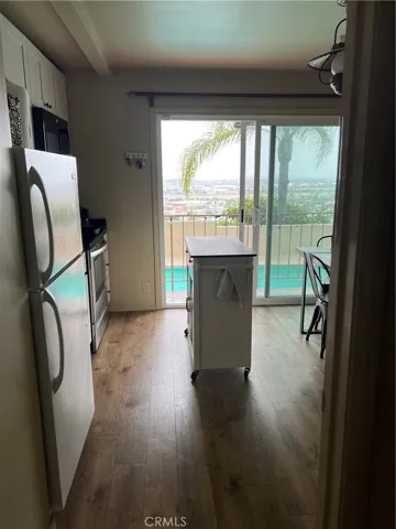 Kitchen with sliding glass doors leading to patio and pool