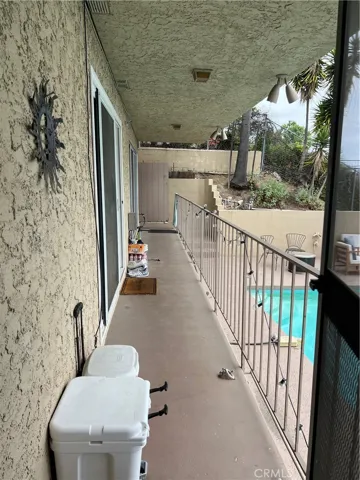 Outside walkway between second bedroom, kitchen and primary bedroom