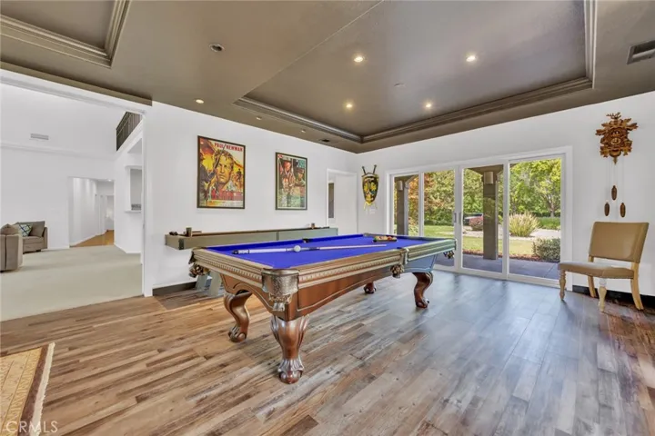 Elegant Game Room Area with Bar located close by!
