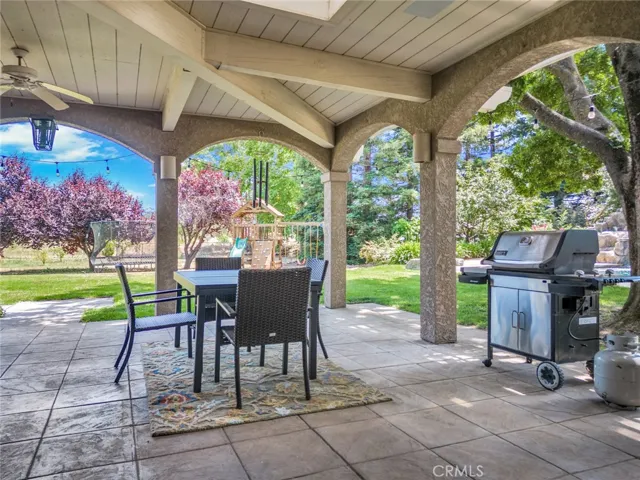 Can you imagine BBQing in this perfect spot while watching the kids play on the swing set and trampoline?