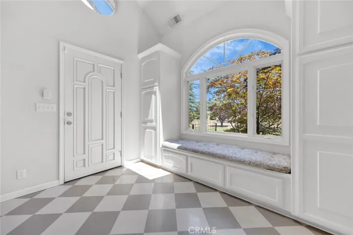Formal Entryway with so much storage and functional bench seat!