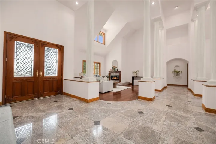 Large double door entry with open high ceilings