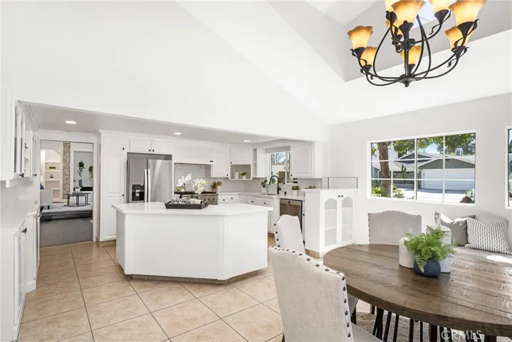 view from dining area past the kitchen into the living room