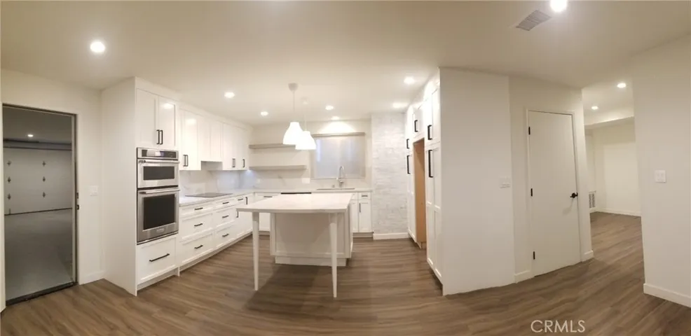 Kitchen with the Garage in view through the door on the left
