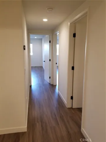 Downstairs Hallway looking towards bedrooms, and the first door onthe right is the Laundry Room