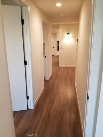 Downstairs, looking down hallway from bedrooms toward Foyer