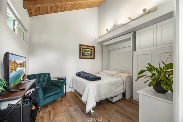 The downstairs bedroom or office with a built-in murphy bed and closet.