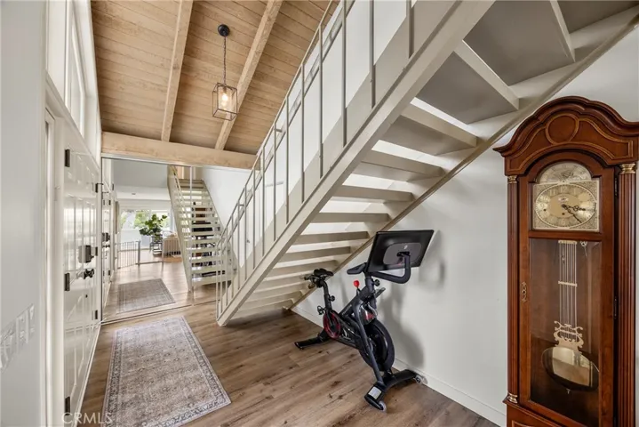 The entry way with a mirrored storage closet.