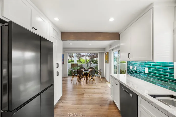 The view from the kitchen into the dining area and out to the back yard.