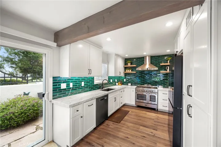 The beautifully updated kitchen with quartz counter tops, and newer appliances.