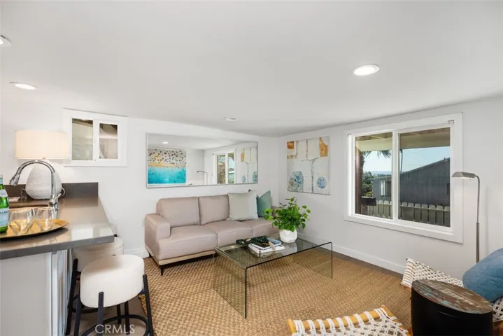 Downstairs Unit Upgraded Kitchen opens to Living Room with Ocean View