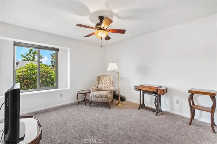 Bedroom #2: full-sized room, carpeting, custom ceiling fan/light, large window, blinds.