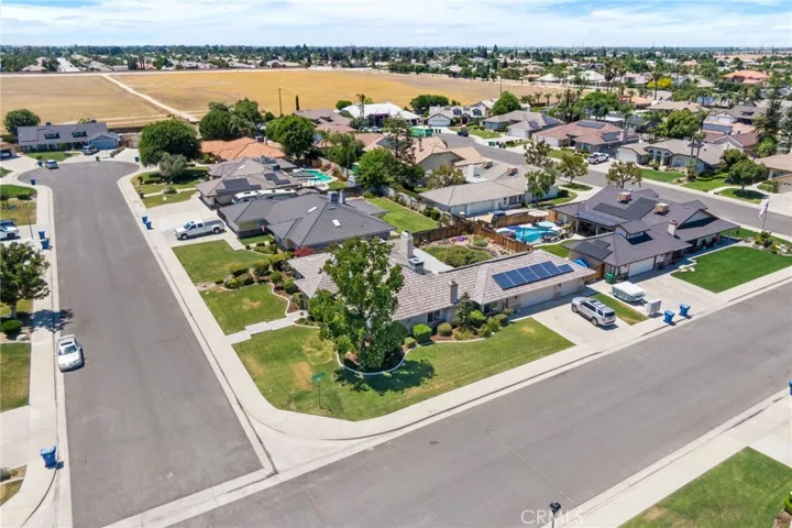 Aerial View: large corner lot, cul-de-sac street.