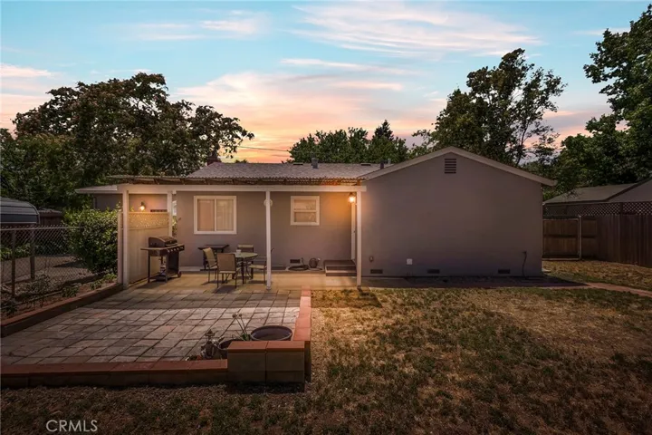 Backyard SVery Sturdy Stucco and Brick Construction with At active Wisteria Vines located on a larg quarter acre, mostly fenced-in lot. 1532 Sqft 3/2 hom is also commercially zoned to run your own business from home!hot