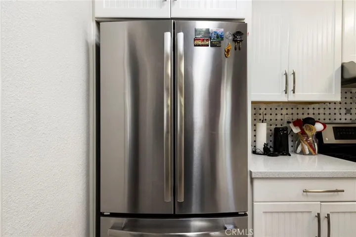 Completely Remodeled Kitchen with Stainless Steel Appliances, New Cabinets, Quartz Counters, Water-resistant Laminate and Glass Back Splash!