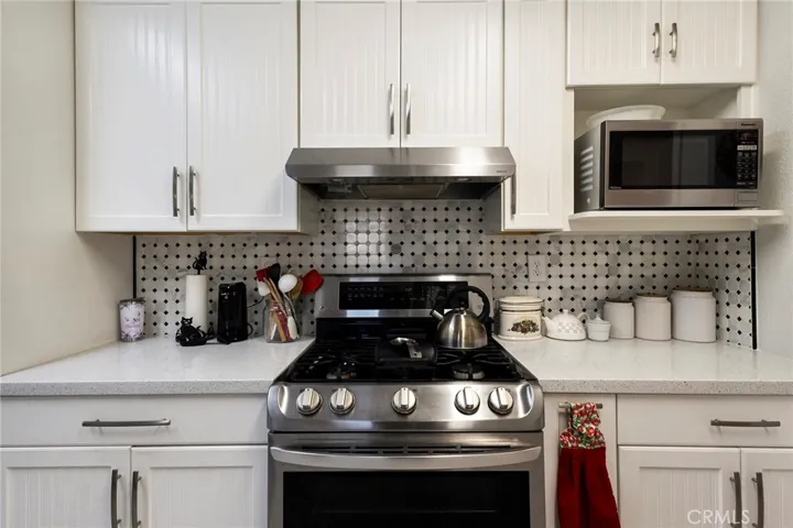Completely Remodeled Kitchen with Stainless Steel Appliances, New Cabinets, Quartz Counters, Water-resistant Laminate and Glass Back Splash!