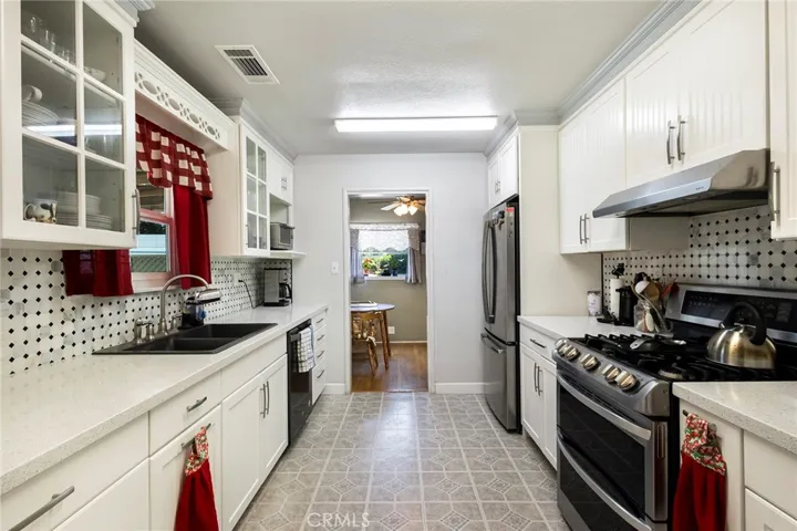 Completely Remodeled Kitchen with Stainless Steel Appliances, New Cabinets, Quartz Counters, Water-resistant Laminate and Glass Back Splash!