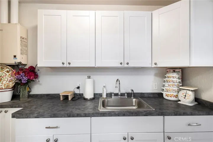 Completely Remodeled Kitchen with Stainless Steel Appliances, New Cabinets, Quartz Counters, Water-resistant Laminate and Glass Back Splash!