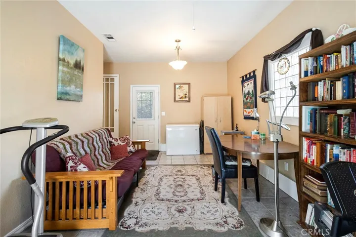 3rd bedroom has separate entrances which include access to carport and front yard area. Located on other side of two other bedrooms. Could be used as an ADU setup.