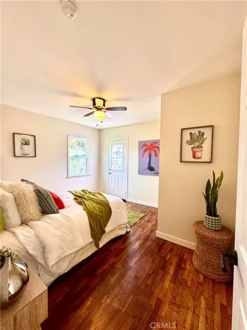 Large Primary bedroom with door to side.
